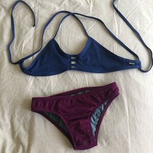 Jolyn bikini.  Colors are Blue top and burgundy/wine bottoms.  Size Small.